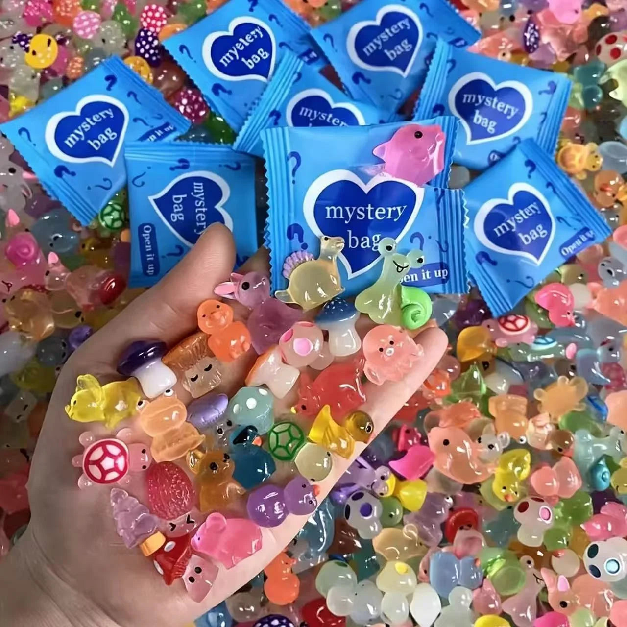 MangBol glow-in-the-dark mini resin animal mystery bags with assorted colorful figures