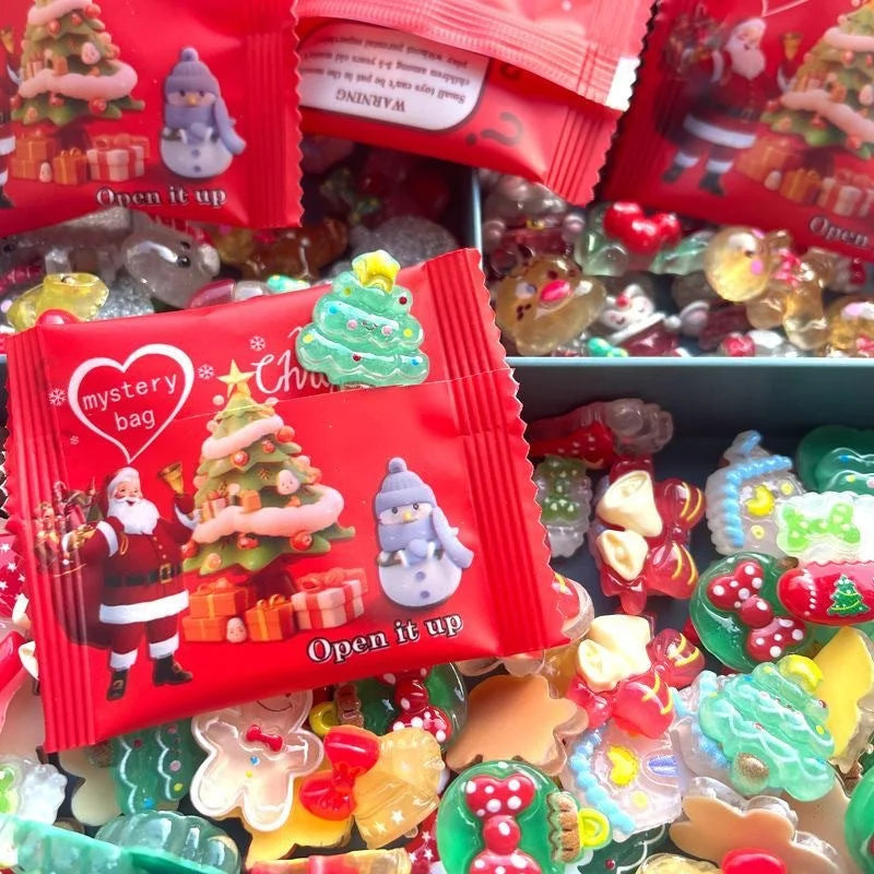 Red Christmas blind bag opened among colorful glowing holiday charms