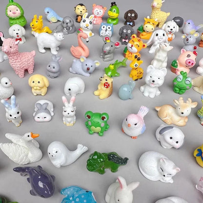 Colorful 3D resin animal blind bag figures arranged on a gray background