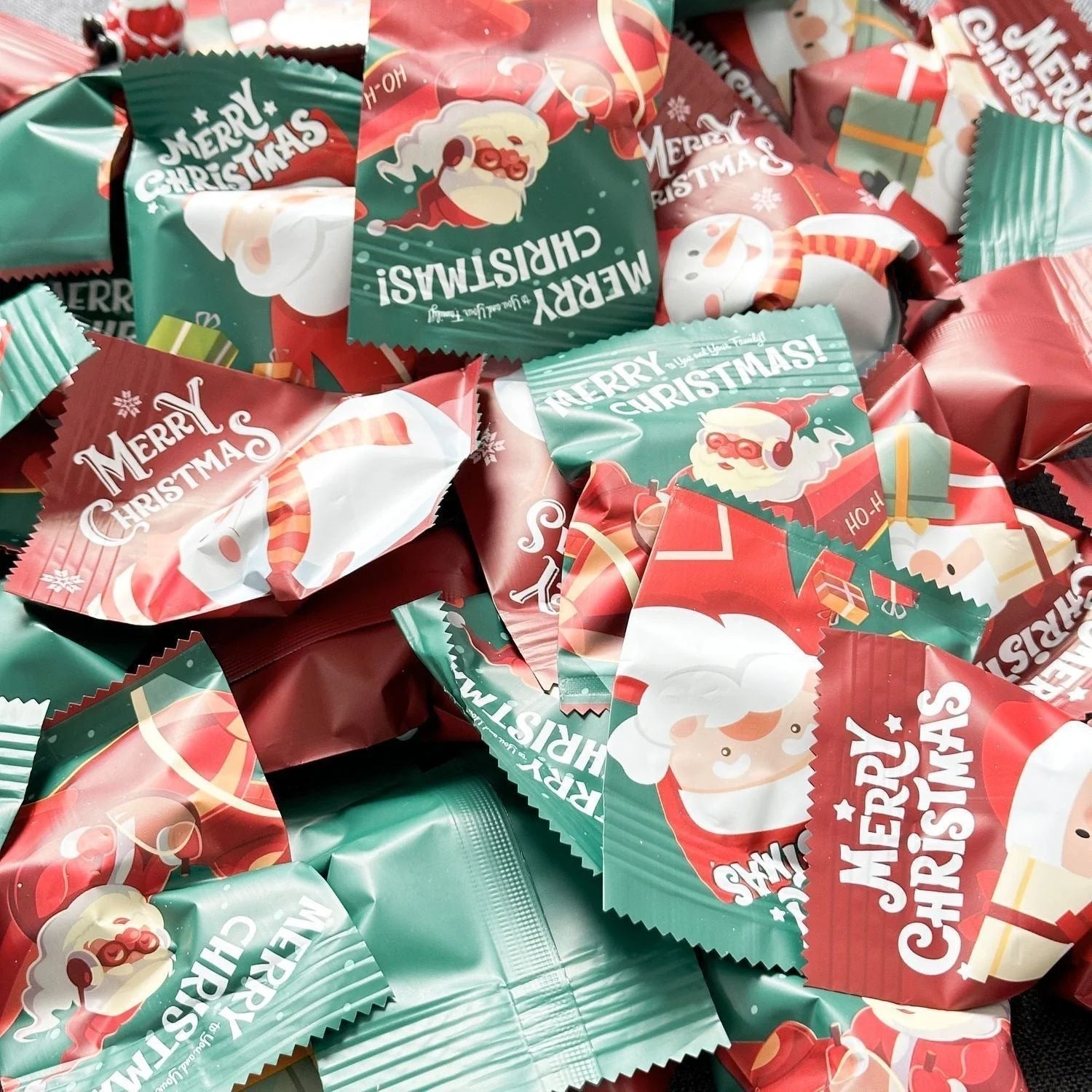 Pile of red and green Merry Christmas miniature figure blind bags
