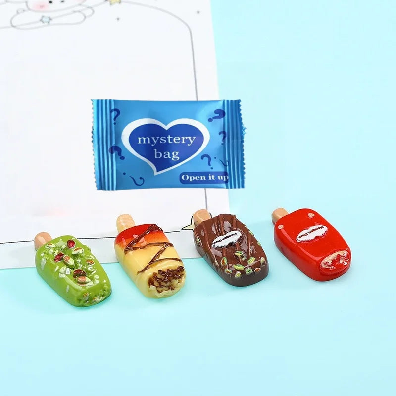 Four mini popsicle charms and one blue mystery bag for DIY crafts