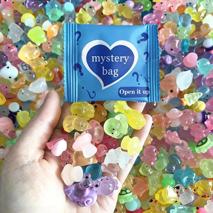 Blue mini animal mystery bag surrounded by colorful resin animal figures
