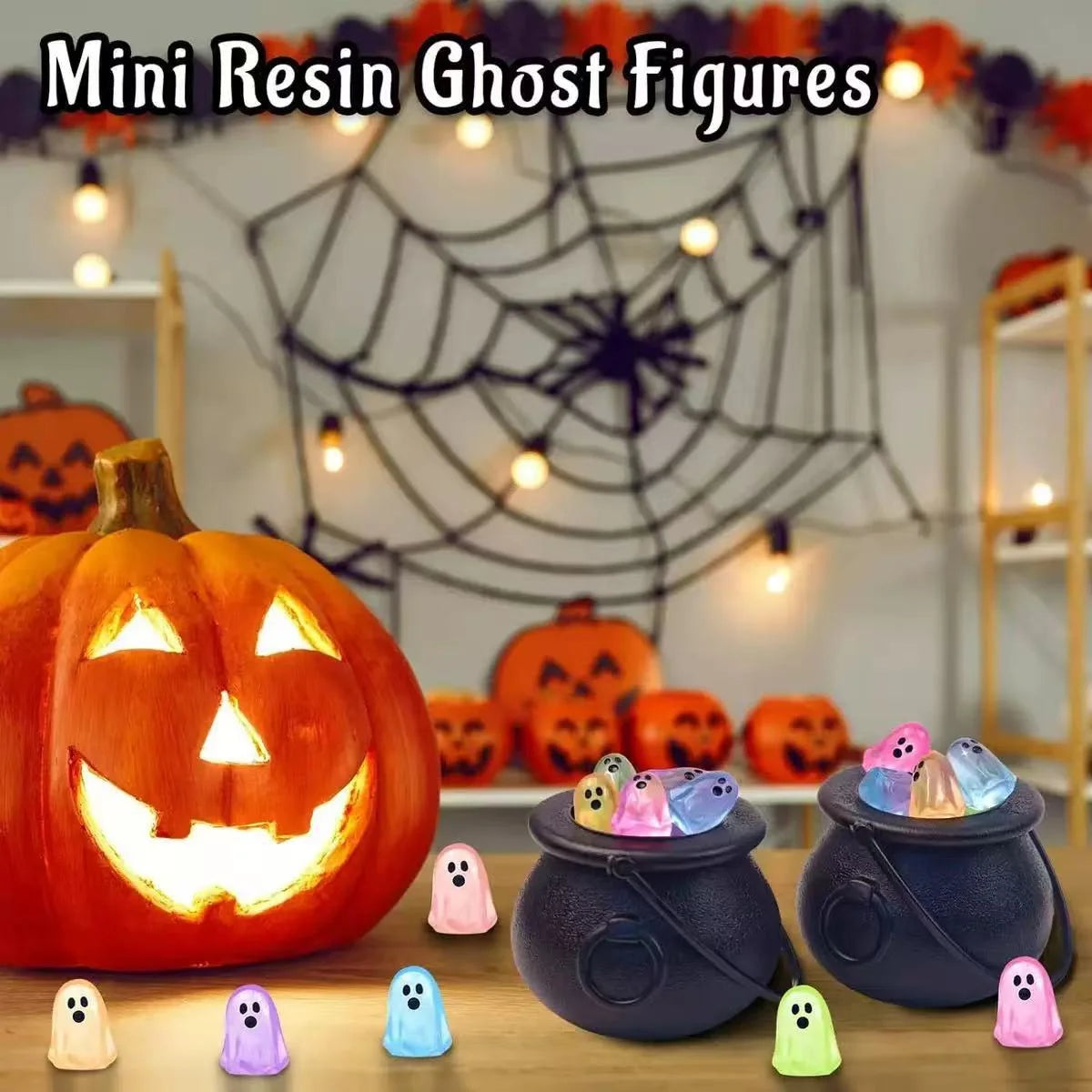 Glow-in-the-dark mini ghost figurines decorating a Halloween pumpkin scene
