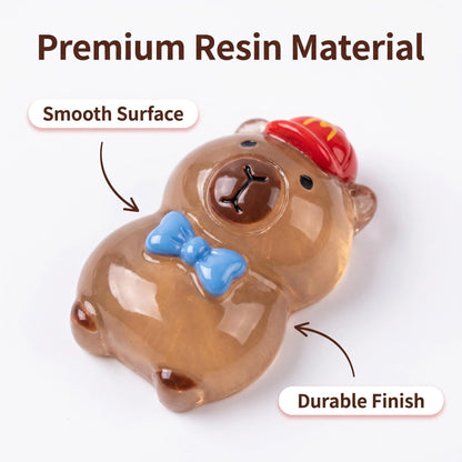 Close-up of smooth glossy capybara resin charm with bow tie