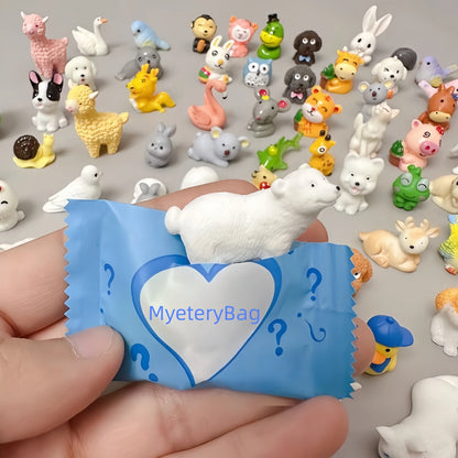 White rabbit figure emerging from a blue mini animal mystery bag