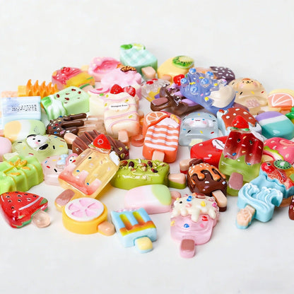 Pile of miniature fruit, chocolate and character popsicle collectibles
