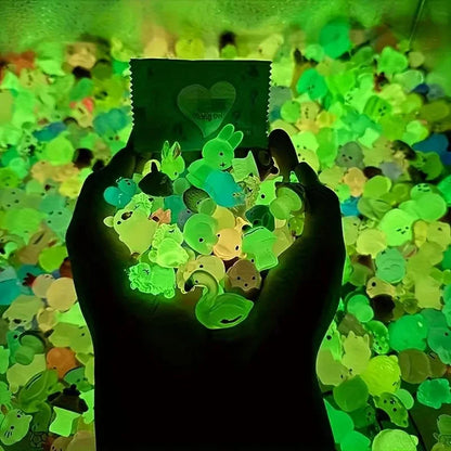 Mini resin animal figures glowing green in cupped hands